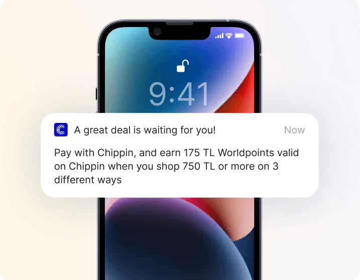 Phone lock screen showing a push notification offering loyalty points for using a payment app on purchases over a spending threshold at partner stores.