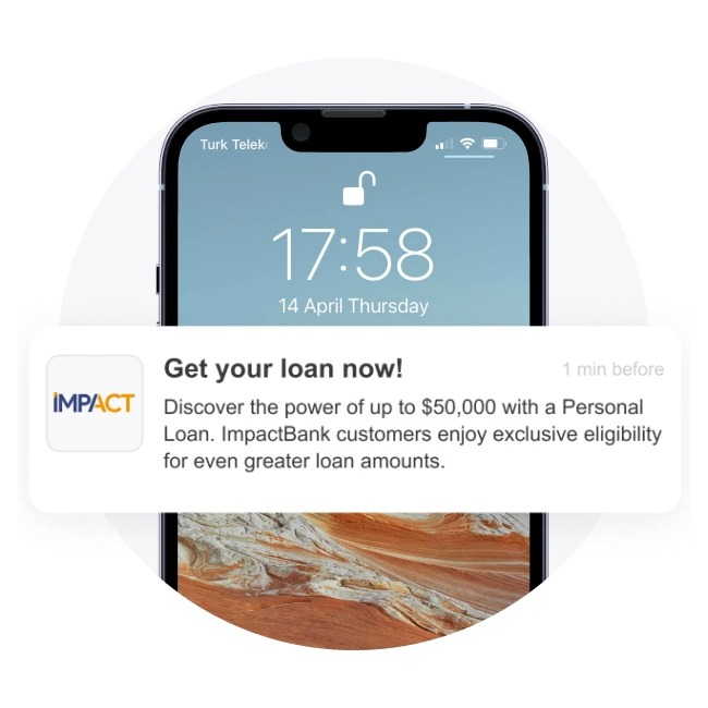 A smartphone displaying a lock screen push notification from ImpactBank with the headline "Get your loan now!" offering a personal loan of up to $50,000.