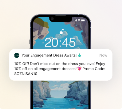 Smartphone lock screen displaying a push notification: "Your Engagement Dress Awaits!" It offers 10% off engagement dresses with a specific promo code.