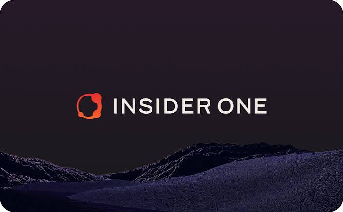 Insider One logo in white text with a red circular icon, set against a dark mountain silhouette background.