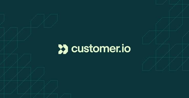Customer.io logo in light green text on a dark teal background with a faint geometric pattern.